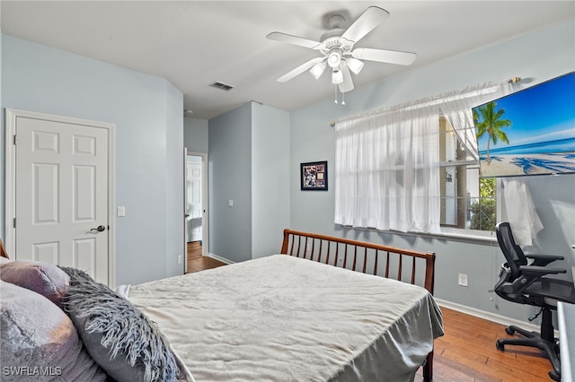 bedroom featuring hardwood / wood-style flooring and ceiling fan