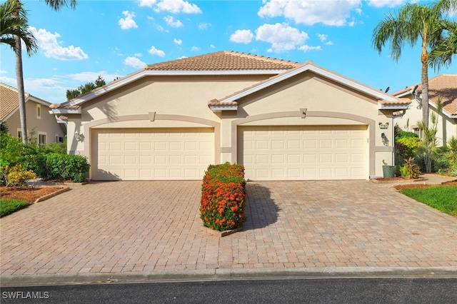 mediterranean / spanish-style home featuring a garage