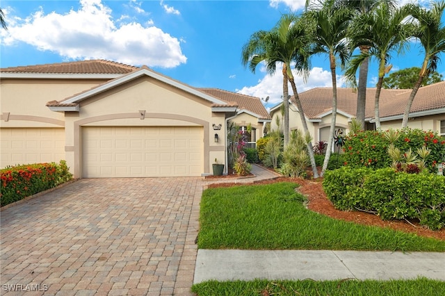 mediterranean / spanish-style house featuring a garage