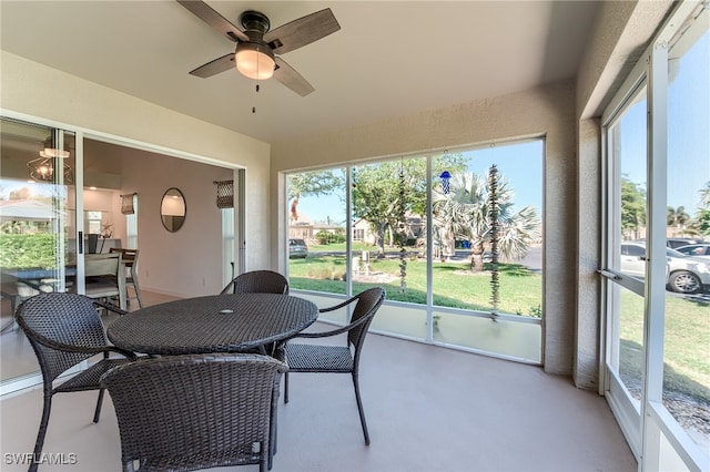 sunroom featuring ceiling fan