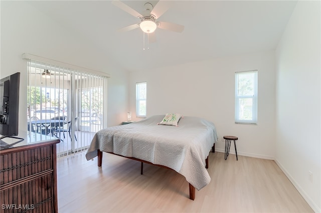 bedroom with access to outside, ceiling fan, light hardwood / wood-style floors, and vaulted ceiling