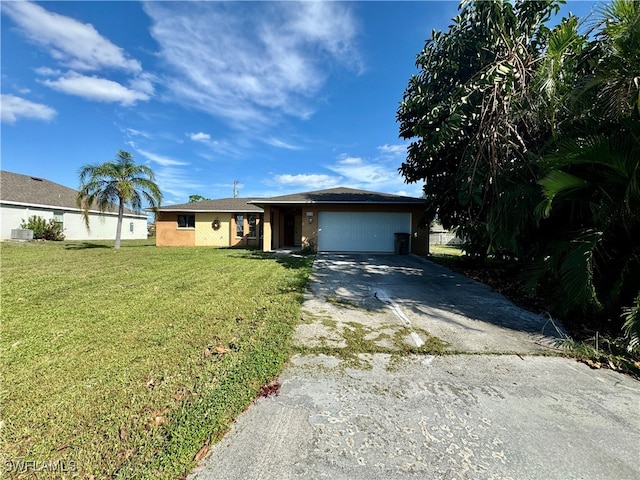 ranch-style home with a garage and a front lawn