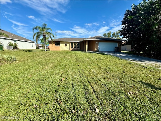 ranch-style house with central air condition unit, a front lawn, and a garage