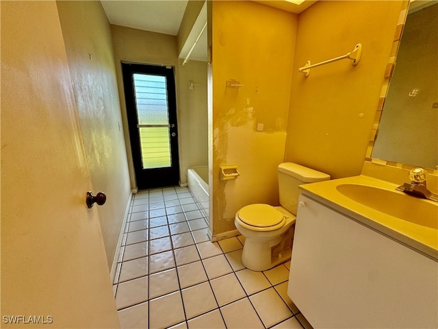 bathroom featuring tile patterned flooring, vanity, and toilet