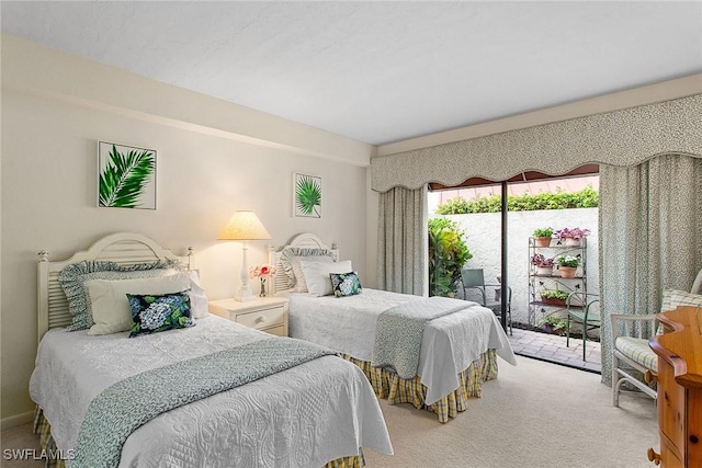 bedroom featuring carpet floors and access to exterior