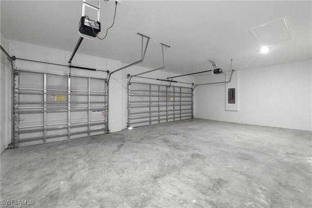 garage with electric panel and a garage door opener