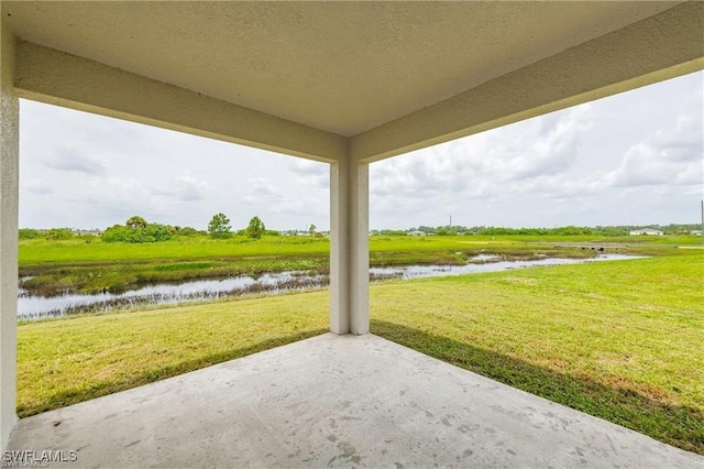 view of patio featuring a water view