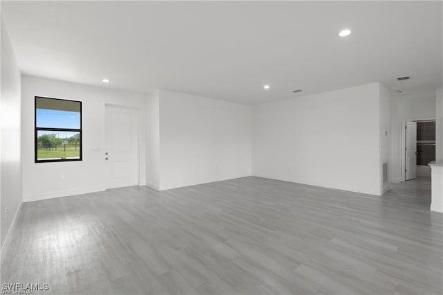 unfurnished room with light wood-type flooring