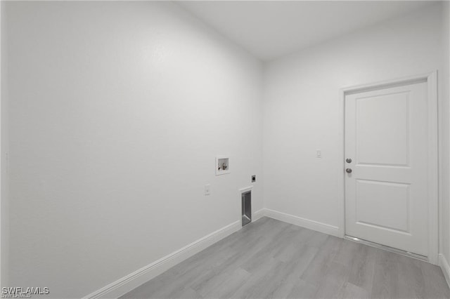 laundry room featuring washer hookup, light wood-type flooring, and hookup for an electric dryer