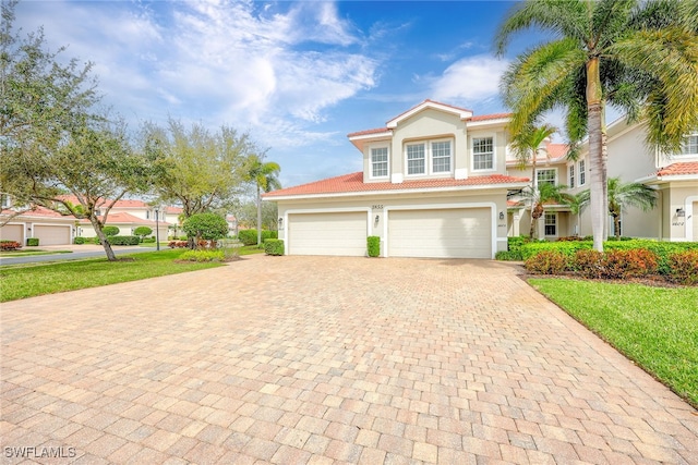 mediterranean / spanish-style home featuring a garage