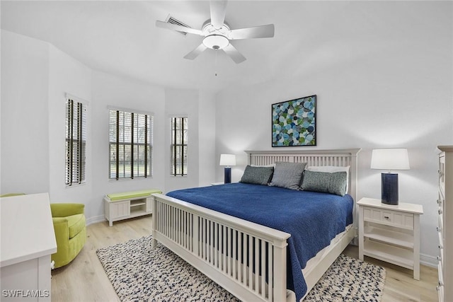 bedroom with ceiling fan and light hardwood / wood-style floors