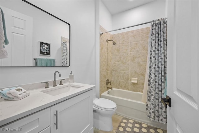 full bathroom featuring toilet, vanity, and shower / bath combo with shower curtain