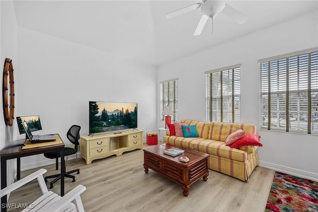 living room with ceiling fan and light wood-type flooring