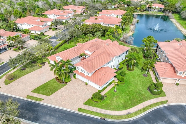 drone / aerial view with a water view