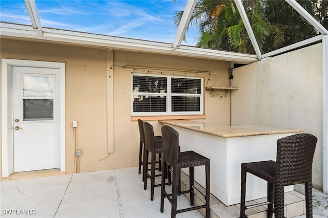 exterior space featuring an outdoor bar