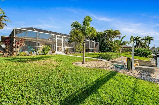 view of yard with glass enclosure