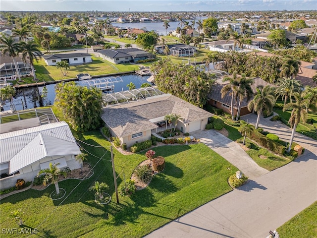 drone / aerial view with a water view