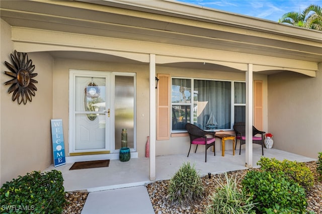 entrance to property featuring a porch