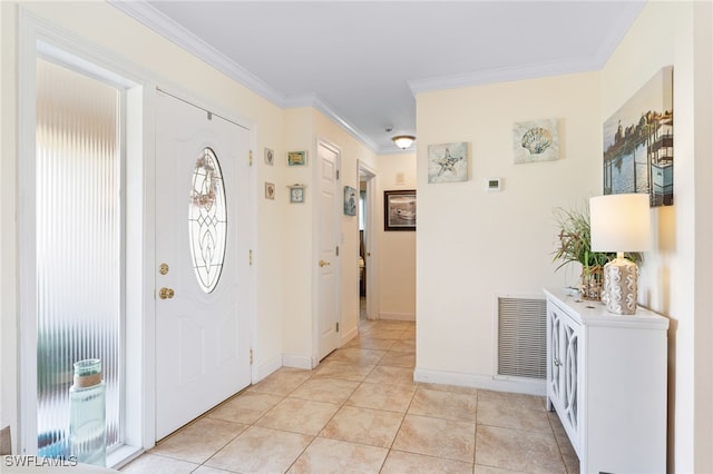 tiled foyer entrance featuring ornamental molding