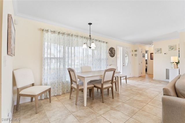 dining area featuring light tile patterned floors, crown molding, and a chandelier