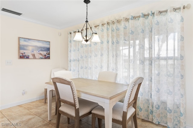 tiled dining room with crown molding and a notable chandelier