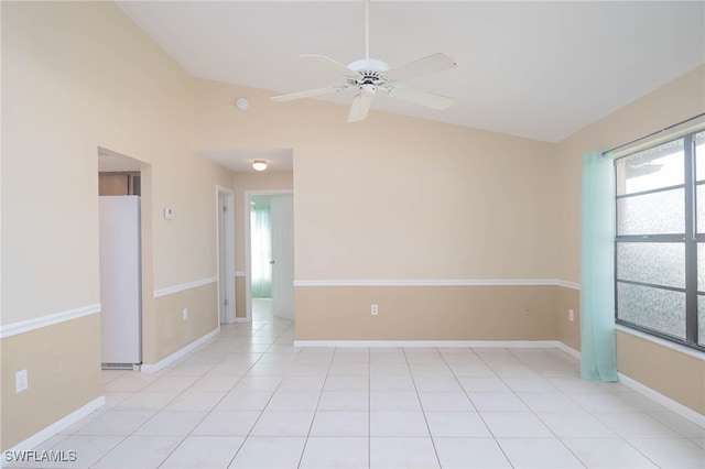 unfurnished room with ceiling fan, light tile patterned flooring, and lofted ceiling