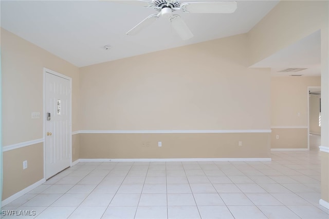 tiled spare room with ceiling fan