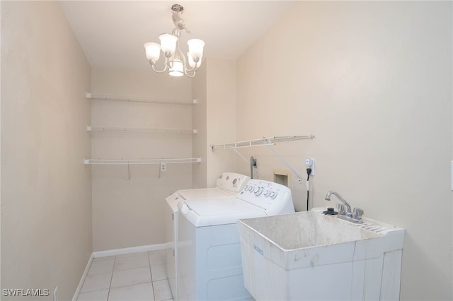 laundry room with light tile patterned flooring, independent washer and dryer, sink, and a chandelier