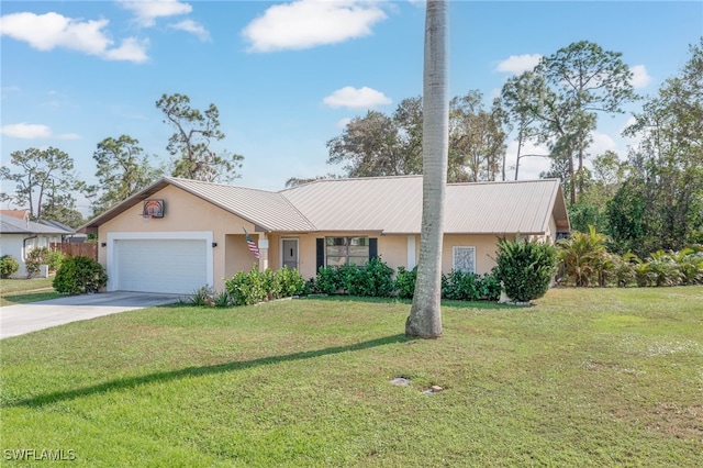 single story home featuring a garage and a front lawn