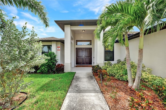 entrance to property with a yard