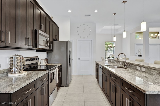 kitchen featuring a chandelier, hanging light fixtures, appliances with stainless steel finishes, and sink