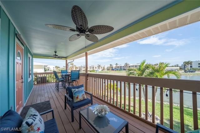 wooden deck featuring ceiling fan