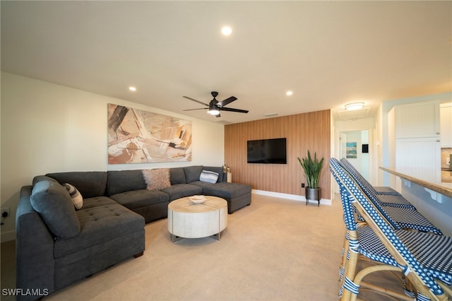 living room featuring ceiling fan and light carpet