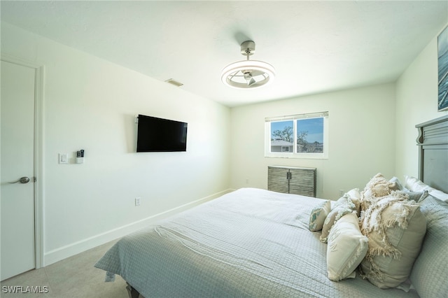 bedroom with light colored carpet