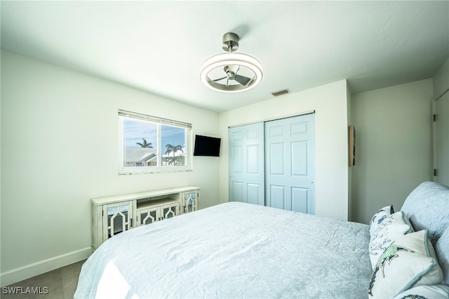 carpeted bedroom with a closet