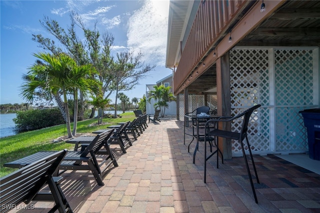 21671/21673 Indian Bayou Dr, Fort Myers Beach, FL 33931 - view of patio featuring a water view and outdoor dining area
