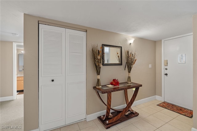 entryway with light tile patterned floors