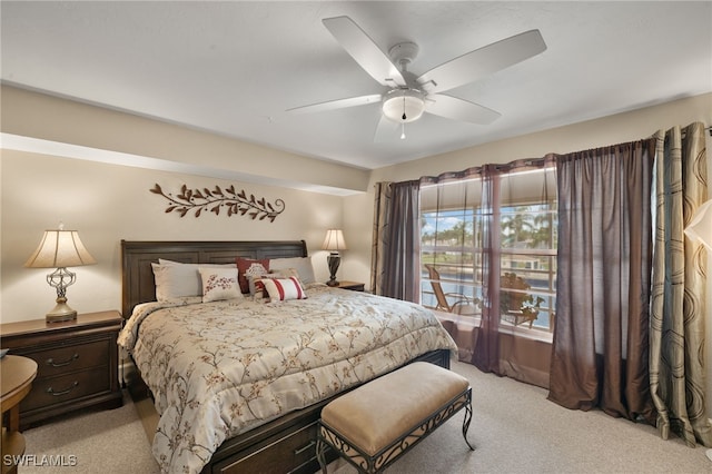 bedroom with ceiling fan and light colored carpet