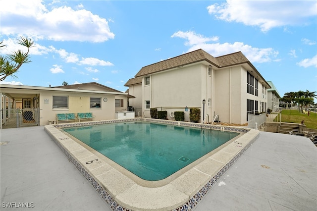 view of pool featuring a patio area