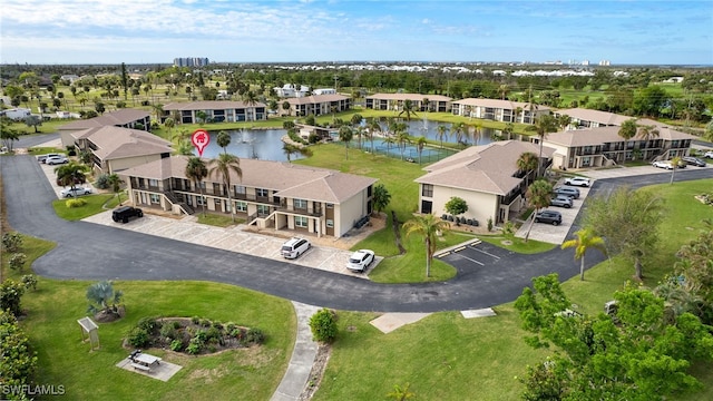 birds eye view of property featuring a water view