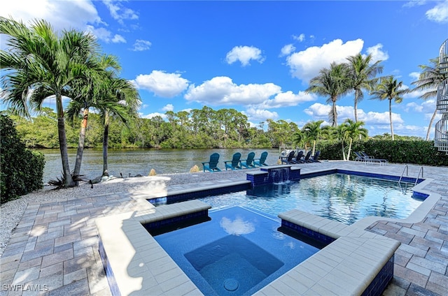 view of swimming pool with an in ground hot tub, a patio, a water view, and pool water feature