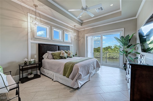 bedroom featuring access to outside, ceiling fan with notable chandelier, ornamental molding, a tray ceiling, and light tile patterned flooring