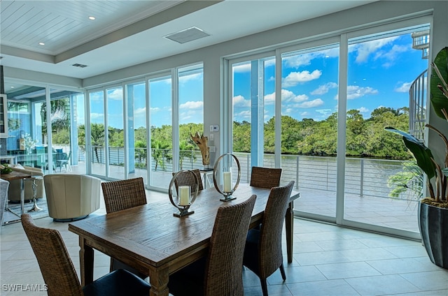 sunroom featuring a tray ceiling