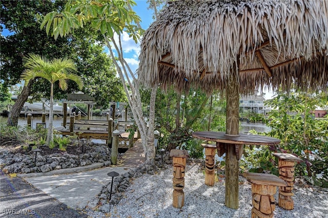 view of home's community featuring a boat dock