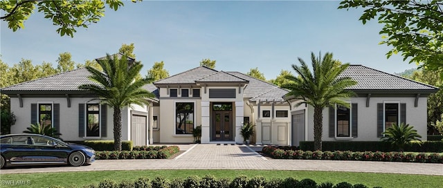 view of front of home featuring french doors, a tiled roof, and stucco siding