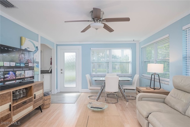 living room featuring light hardwood / wood-style flooring and ceiling fan