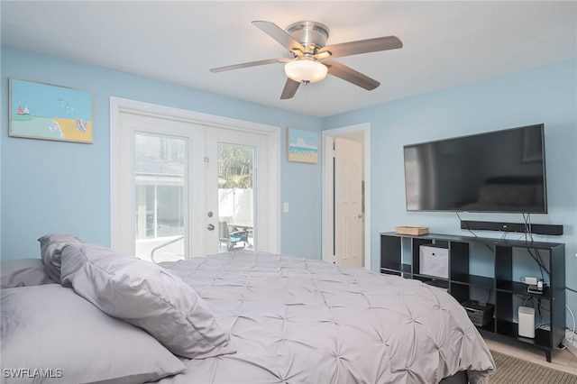 bedroom featuring french doors, access to outside, ceiling fan, and light hardwood / wood-style floors