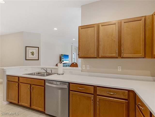 kitchen featuring dishwasher, light tile patterned floors, sink, and kitchen peninsula