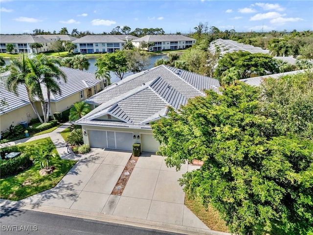 birds eye view of property featuring a water view