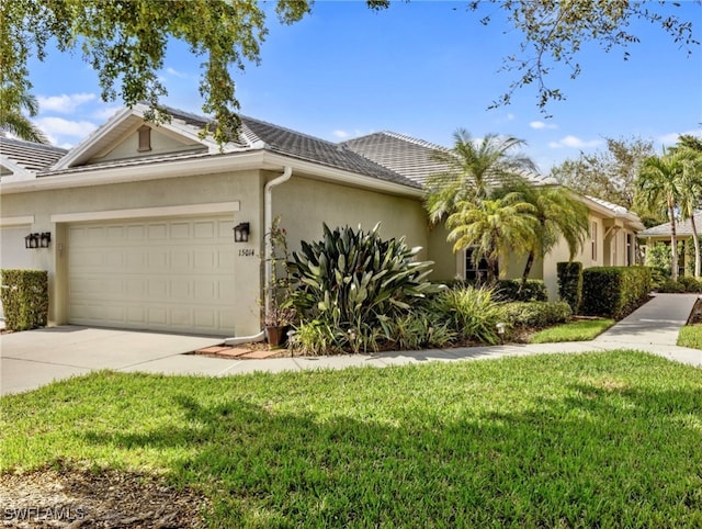 view of front of house with a garage and a front yard